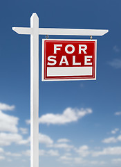 Image showing Right Facing For Sale Real Estate Sign on a Blue Sky with Clouds