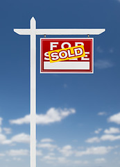 Image showing Right Facing Sold For Sale Real Estate Sign on a Blue Sky with C