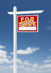 Image showing Right Facing Sold For Sale Real Estate Sign on a Blue Sky with C