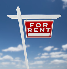 Image showing Right Facing For Rent Real Estate Sign on a Blue Sky with Clouds