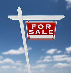 Image showing Right Facing For Sale Real Estate Sign on a Blue Sky with Clouds