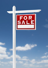 Image showing Right Facing For Sale Real Estate Sign on a Blue Sky with Clouds