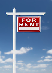 Image showing Right Facing For Rent Real Estate Sign on a Blue Sky with Clouds