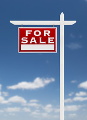 Image showing Left Facing For Sale Real Estate Sign on a Blue Sky with Clouds.