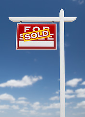 Image showing Left Facing Sold For Sale Real Estate Sign on a Blue Sky with Cl