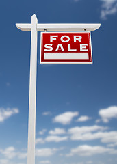 Image showing Right Facing For Sale Real Estate Sign on a Blue Sky with Clouds