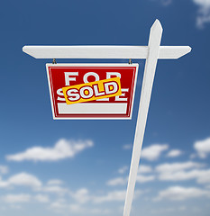 Image showing Left Facing Sold For Sale Real Estate Sign on a Blue Sky with Cl