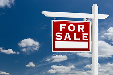 Image showing Left Facing For Sale Real Estate Sign Over Blue Sky and Clouds W