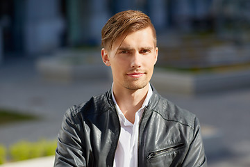 Image showing portrait of young man in leather jacket outdoors