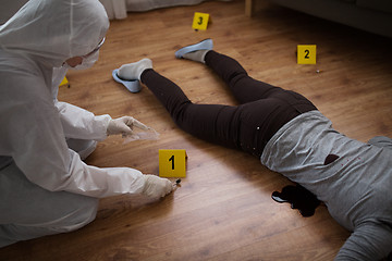 Image showing criminalist collecting crime scene evidence