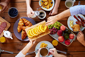 Image showing group of people having breakfast at table