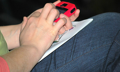 Image showing Female texting.