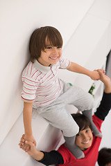 Image showing young boys posing line up piggyback top view