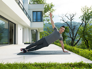 Image showing man doing morning yoga exercises