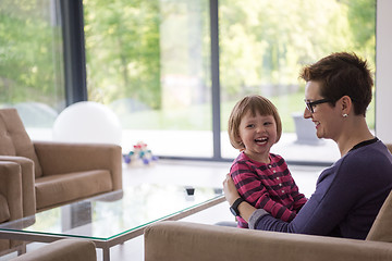 Image showing mother and cute little girl enjoying their free time