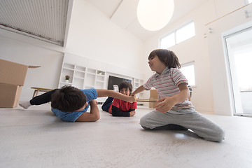 Image showing young boys having fun on the floor