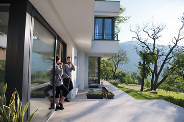 Image showing couple enjoying on the door of their luxury home villa