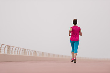 Image showing woman busy running on the promenade