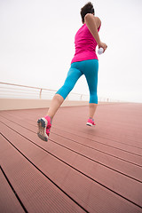 Image showing woman busy running on the promenade