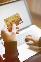 Image showing Woman using credit card for online purchase