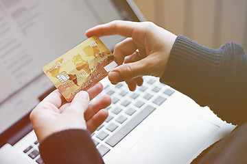 Image showing Woman using credit card for online purchase