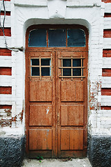 Image showing Wooden doorway in brick wall