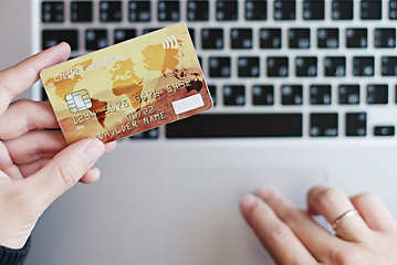Image showing Woman using credit card for online purchase