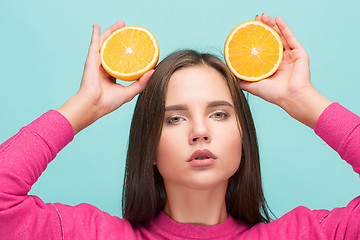 Image showing Beautiful woman\'s face with juicy orange