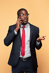 Image showing Young african business man on the phone