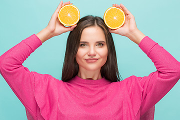 Image showing Beautiful woman\'s face with juicy orange