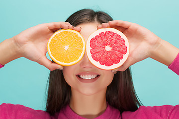 Image showing Beautiful woman\'s face with juicy orange