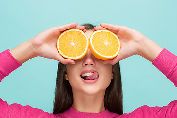 Image showing Beautiful woman\'s face with juicy orange