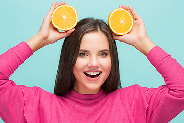 Image showing Beautiful woman\'s face with juicy orange