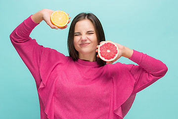 Image showing Beautiful woman\'s face with juicy orange