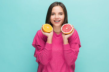 Image showing Beautiful woman\'s face with juicy orange