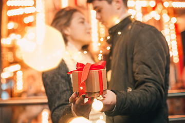 Image showing romantic surprise for Christmas, woman receives a gift from her boyfriend