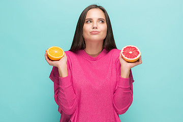 Image showing Beautiful woman\'s face with juicy orange