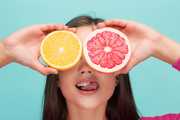 Image showing Beautiful woman\'s face with juicy orange