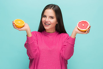Image showing Beautiful woman\'s face with juicy orange