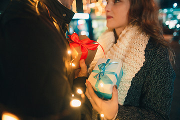 Image showing romantic surprise for Christmas, woman receives a gift from her boyfriend