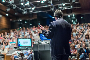 Image showing Public speaker giving talk at Business Event.