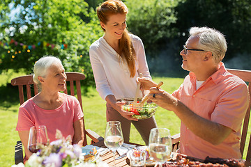 Image showing happy family having dinner or summer garden party