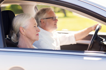 Image showing happy senior couple driving in car