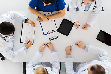 Image showing doctors with cardiograms and tablet pc at hospital