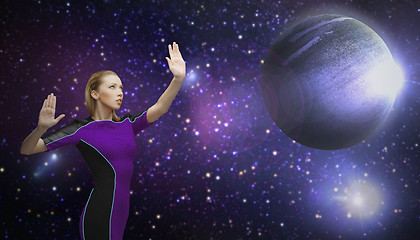 Image showing futuristic woman over planet and stars in space