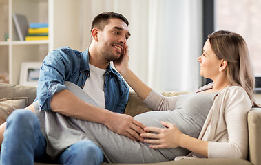 Image showing happy man with pregnant woman at home