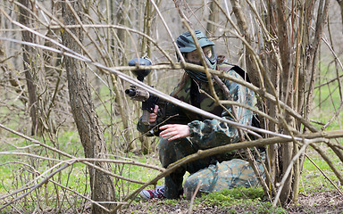 Image showing Paintball player under attack 