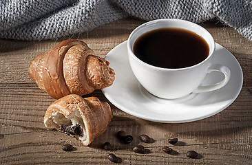 Image showing Black coffee with croissants