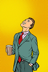 Image showing Businessman drinking coffee and looking up