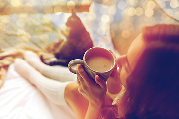 Image showing close up of happy woman with cocoa cup at home